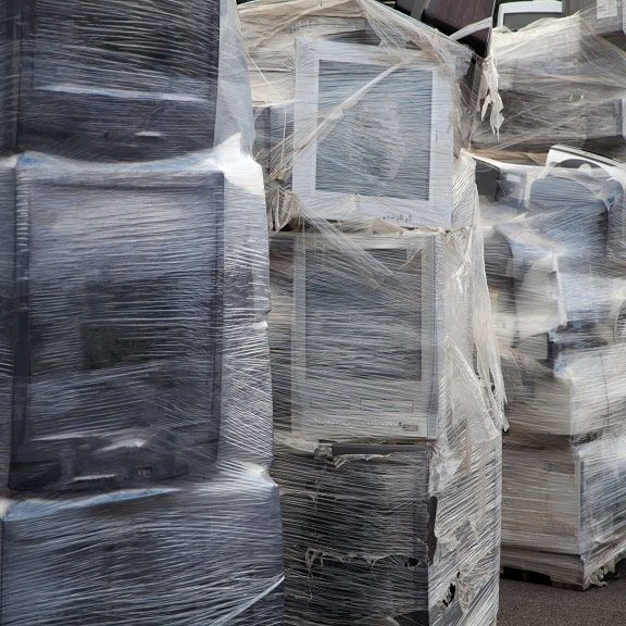 Palettes of old TVs and computers of Acrylonitrile Butadiene Styrene plastic for recycling