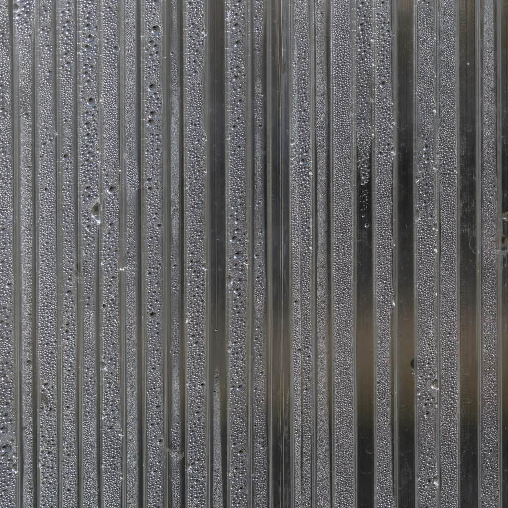 Close-up of a polycarbonate greenhouse wall. Porous polycarbonate sheet with condensation drops inside.