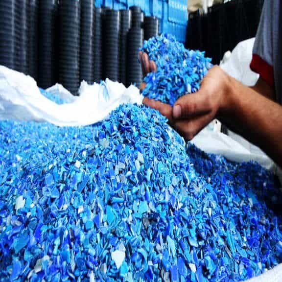 Plastic Resin pellets in holding hands.